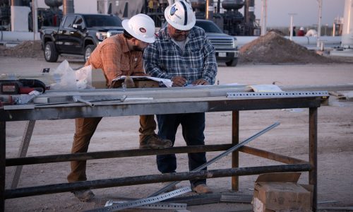 Engineers reading drawings